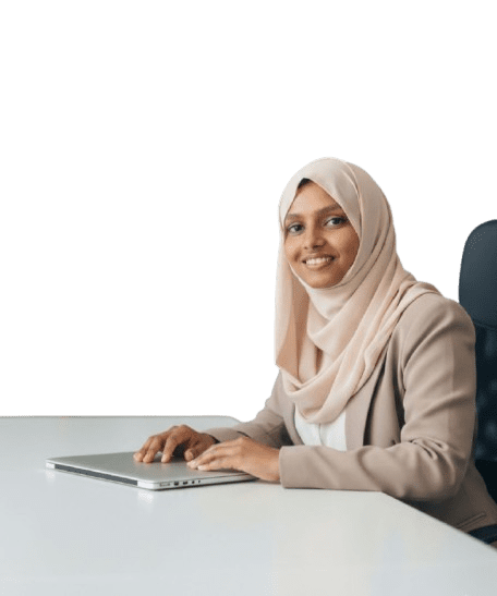 A woman in hijab working at a desk with a laptop, representing a digital marketing freelancer in Kerala.